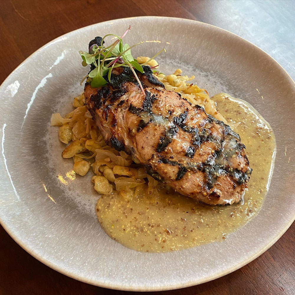 JOSPER GRILLED PORK CHOP Braised Cabbage, Sage Spaetzle, Whole Grain Mustard Jus